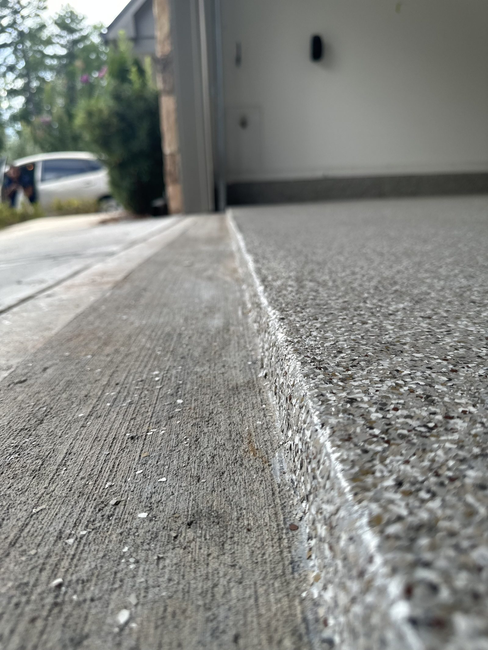 Finished coating edge at the garage threshold