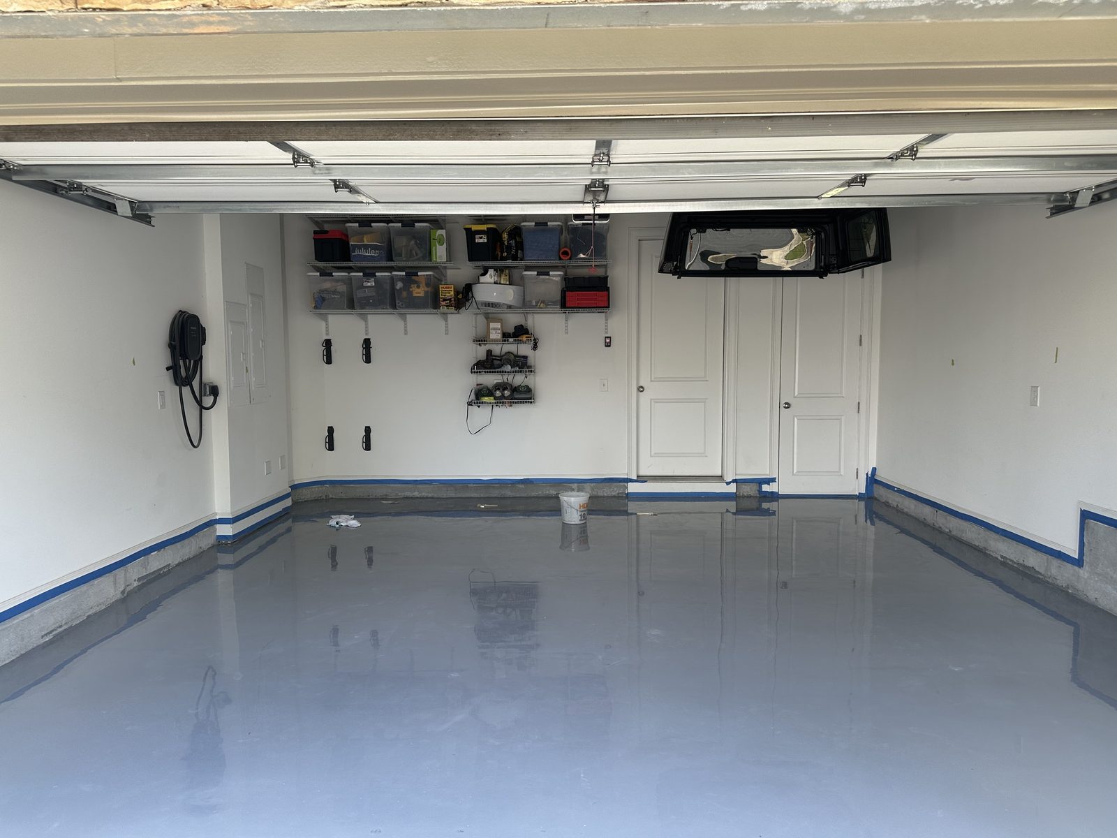Vapor barrier being rolled onto a ground garage slab