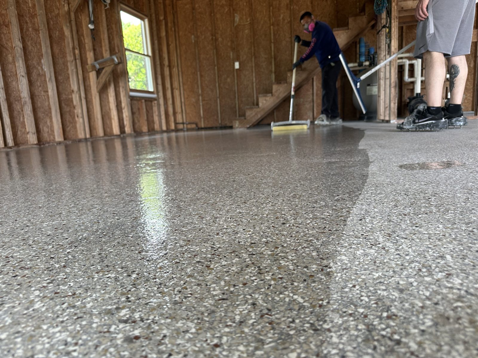 Wet polyaspartic topcoat going down, low angle