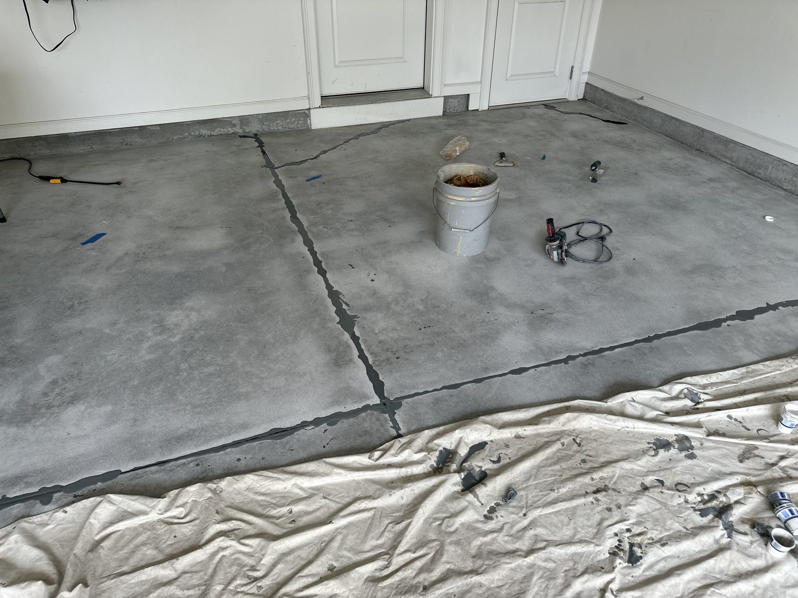 Garage slab with the cracks and joints filled, ready for coating